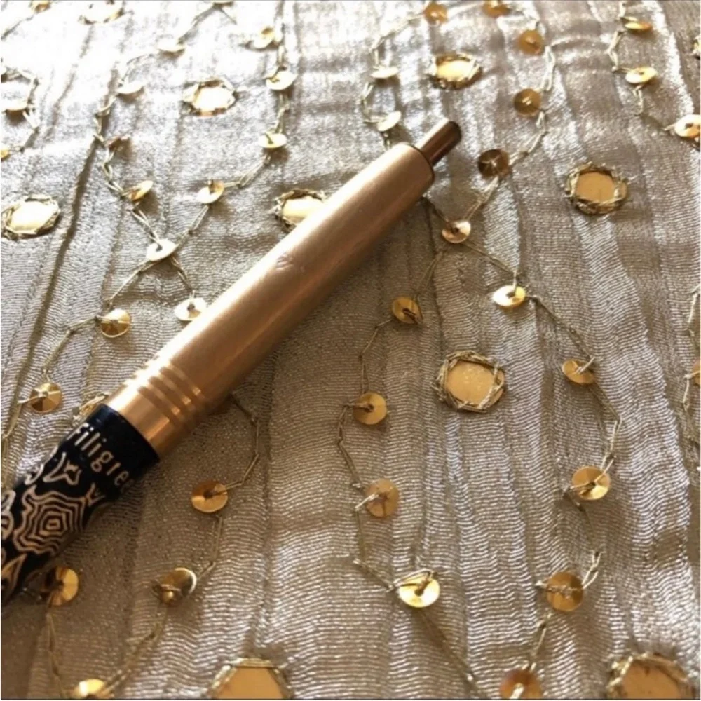 14K gold filigree pen.